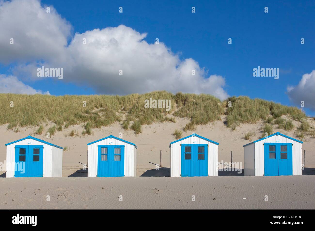 Row of blue and white beach cabins on Texel, West Frisian Island in the Wadden Sea, Noord-Holland, the Netherlands Stock Photo