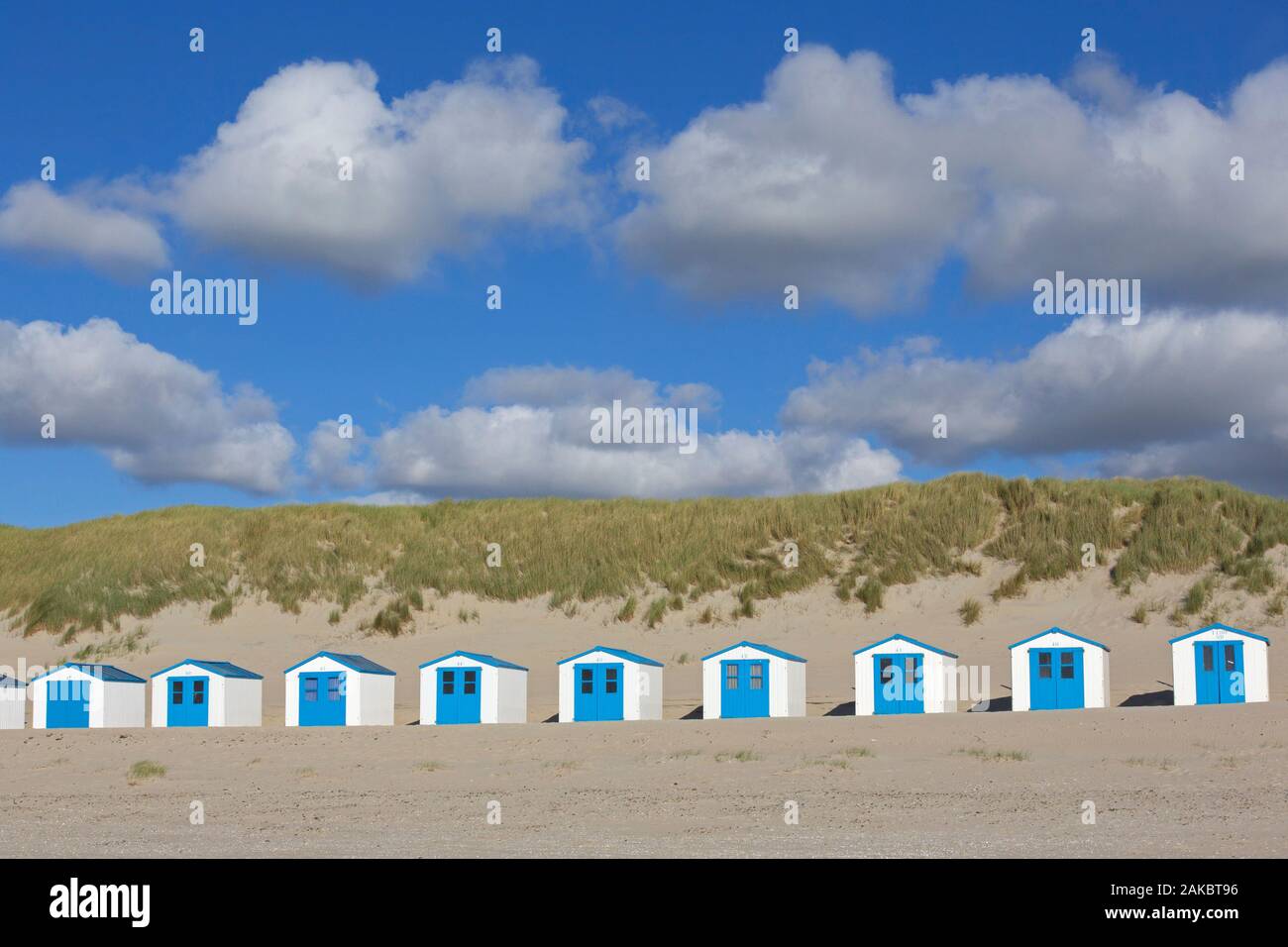 Row of blue and white beach cabins on Texel, West Frisian Island in the Wadden Sea, Noord-Holland, the Netherlands Stock Photo