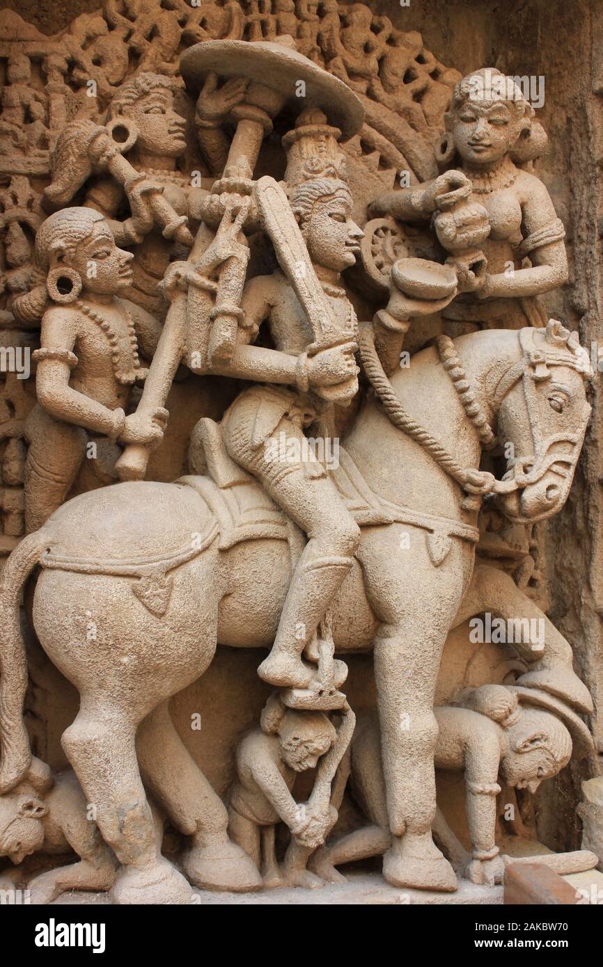 Vishnu avatar Kalki sitting on a horse with sword drawn Stock Photo