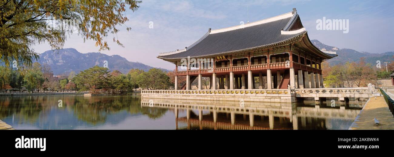 South Korea, Seoul, Kyongheru, View of traditional architecture on a lake Stock Photo