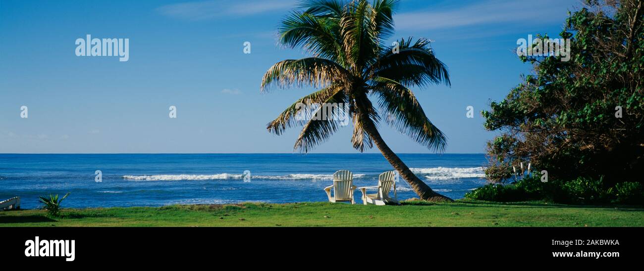 Two adirondack chairs on the beach, Kaneohe Bay, Oahu, Hawaii Islands, USA Stock Photo