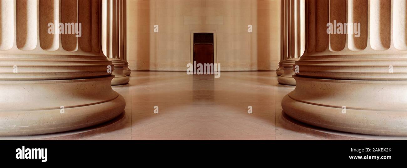 View of columns and door behind Stock Photo