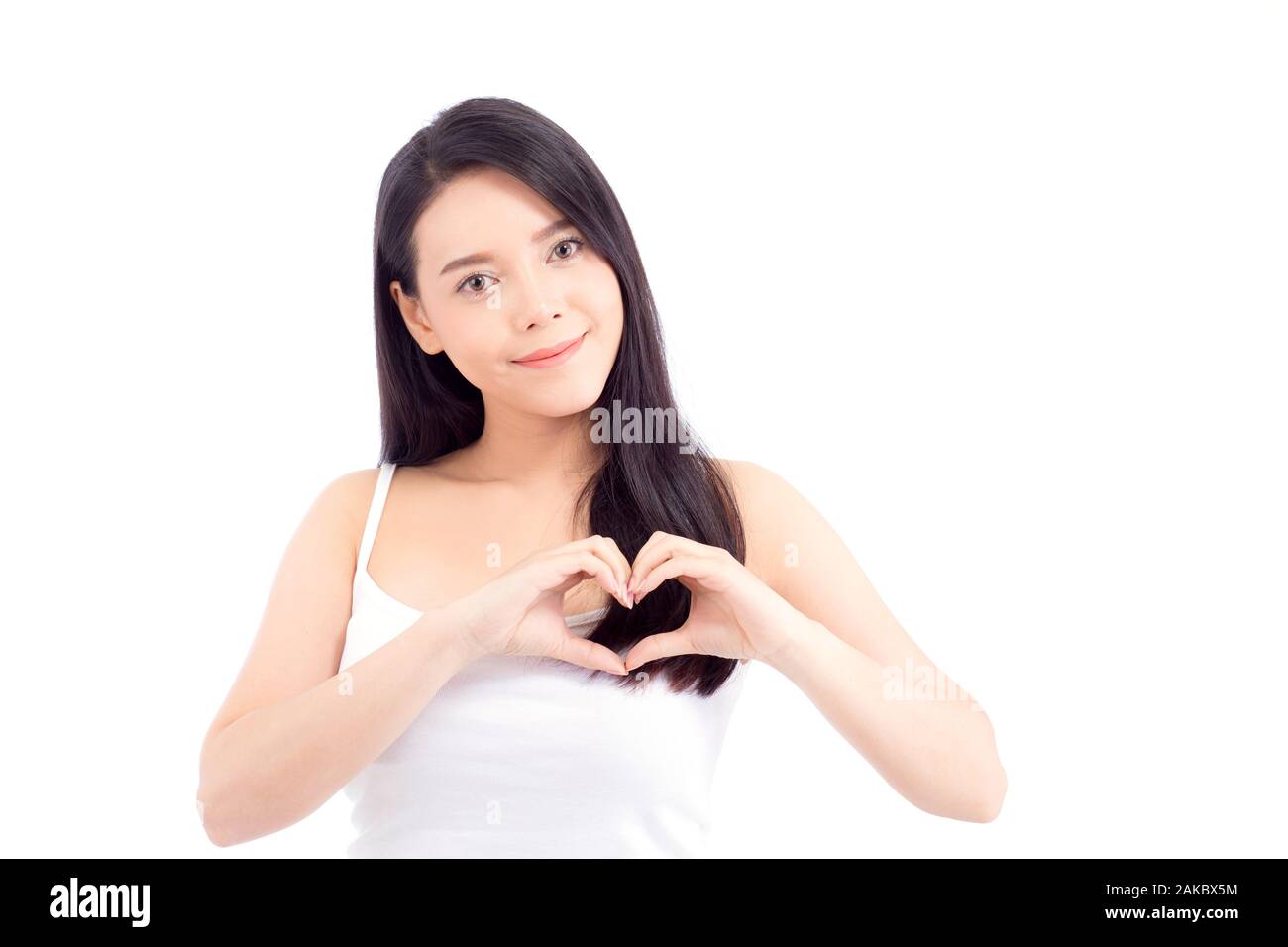 Beautiful asian woman show heart shape with hand, portrait girl model isolated on white background, healthcare concept. Stock Photo