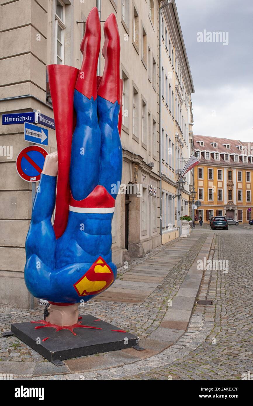 The sculpture 'Auch Helden haben schlechte Tage!' (Heroes have their bad days too, )  by Marcus Witwers from Berlin in front of  the 'Galerie Holger J Stock Photo