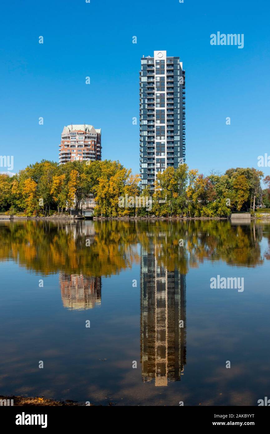 Canada, Province of Quebec, Montreal and Laval, modern buildings on the banks of the Rivière des Prairies, mirror effect Stock Photo