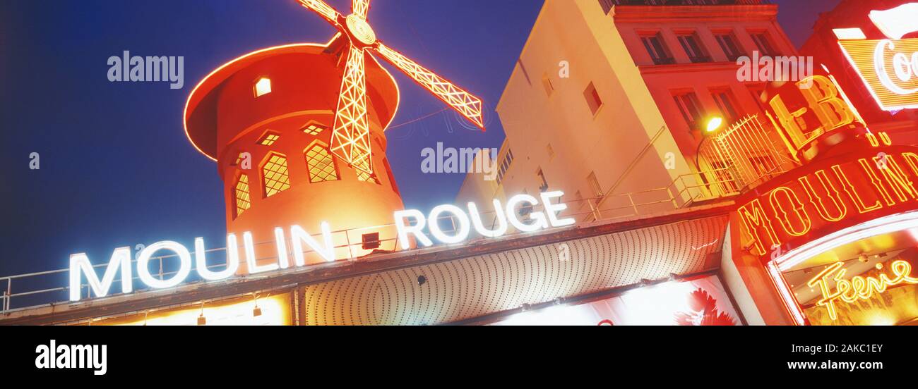 Cabaret building of Moulin Rouge at night, Paris, France Stock Photo