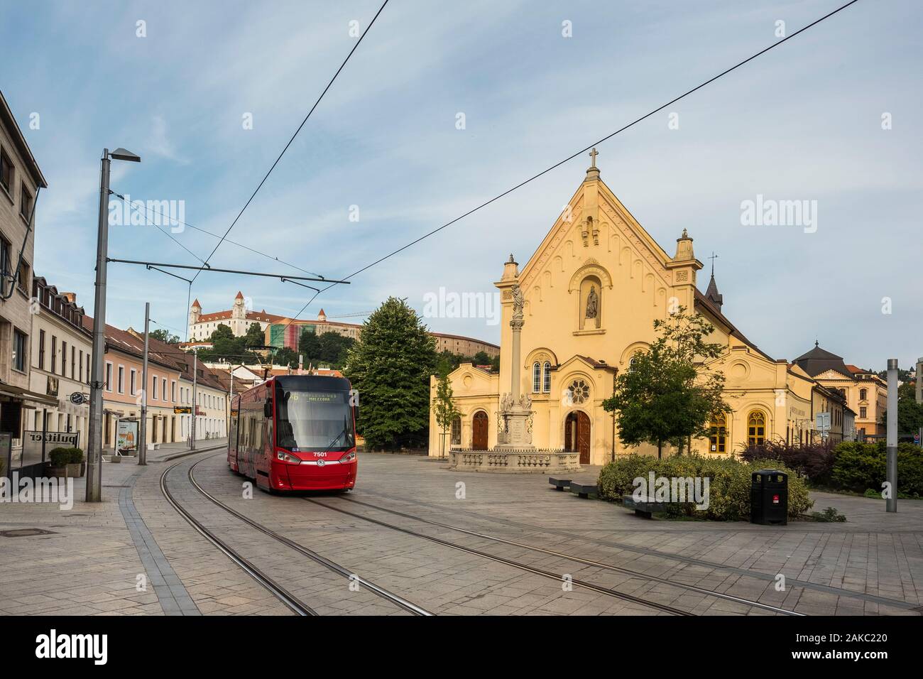 Slovakia, Bratislava, church of the Capuchins consecrated in 1717 and dedicated to Saint-Etienne of Hungary with on its forecourt a column erected in 1723 recalling the epidemic of plague and the tramway which passes in front Stock Photo