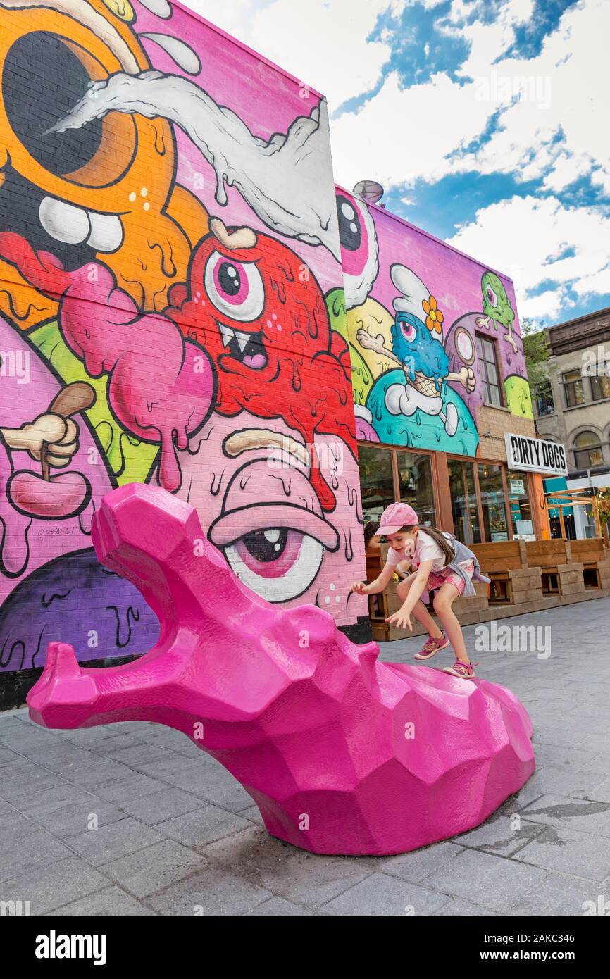 Canada, Province of Quebec, Montreal, the Plateau-Mont-Royal district, the new Guilbault public square, pink hippopotamus sculptures and mural painting by Buff Monster Stock Photo
