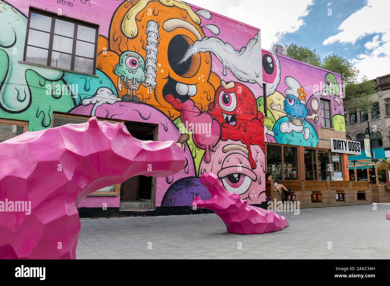 Canada, Province of Quebec, Montreal, the Plateau-Mont-Royal district, the new Guilbault public square, pink hippopotamus sculptures and mural painting by Buff Monster Stock Photo