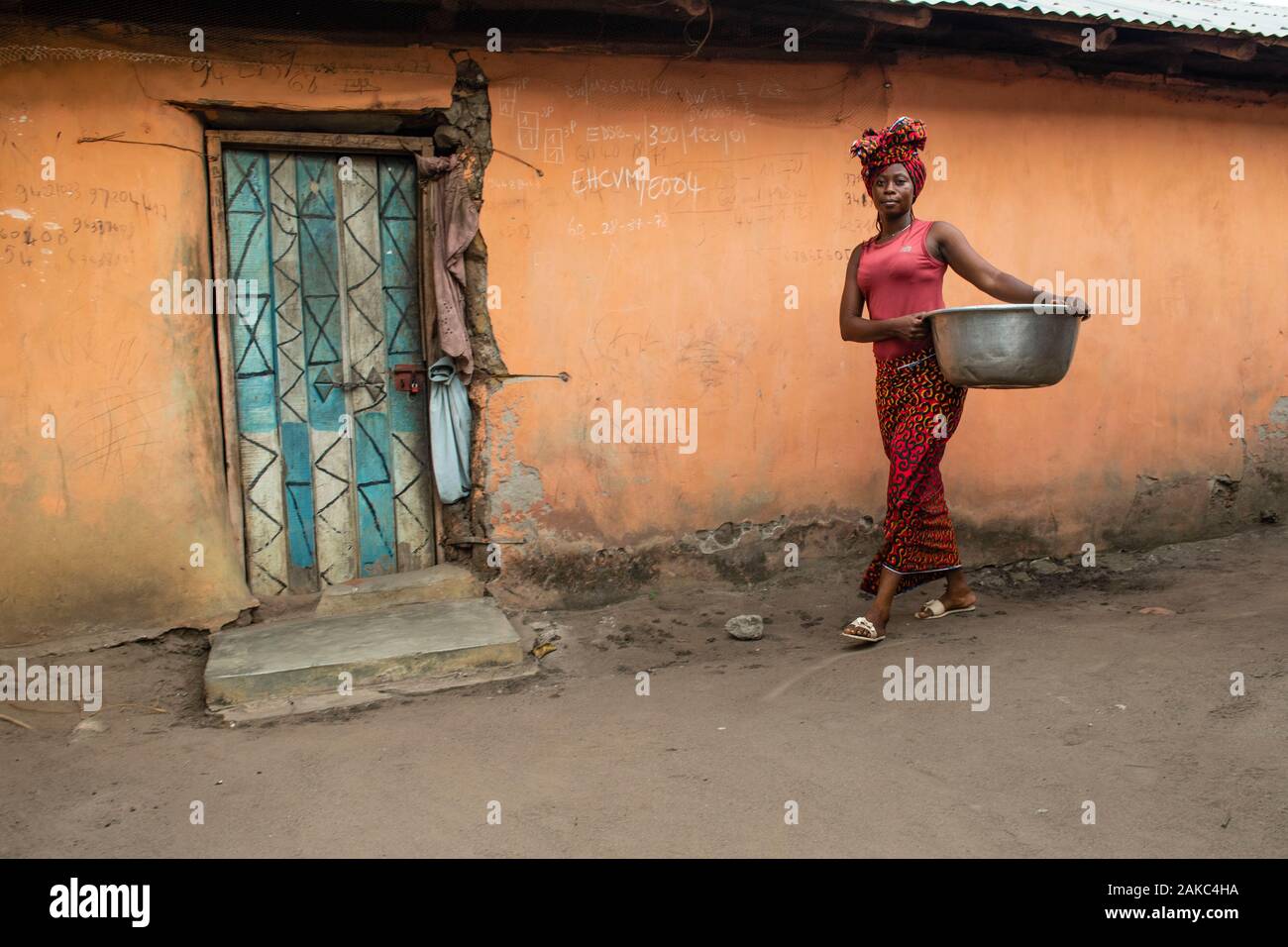 Benin, Natitingou district, woman back from washing clothes Stock Photo