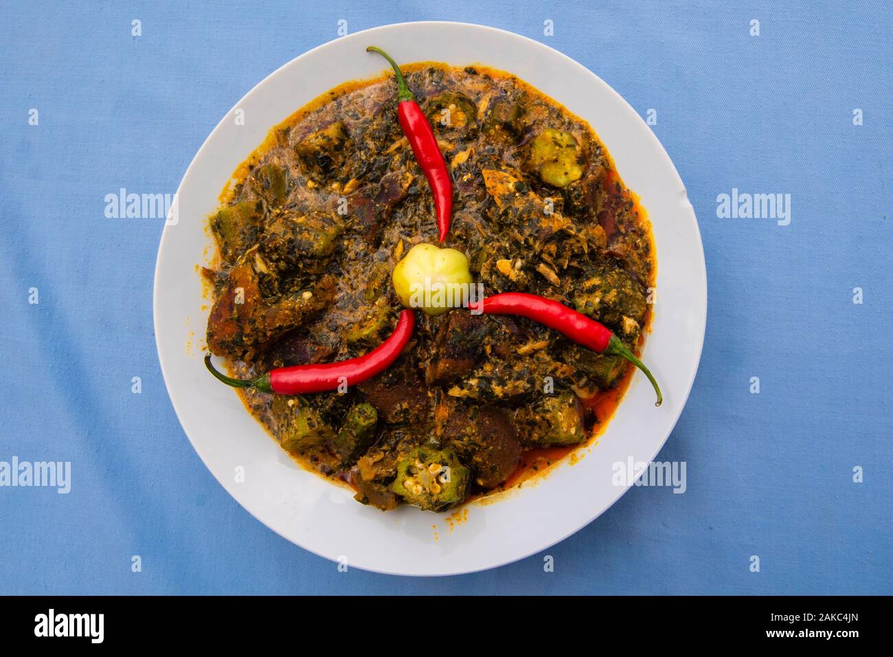 Benin, Atacora area, Nothern district, traditional dish from the north of the country consisting of smoked fish, beef fat, fresh okra, palm oil with a local basil sauce called Azéo Stock Photo