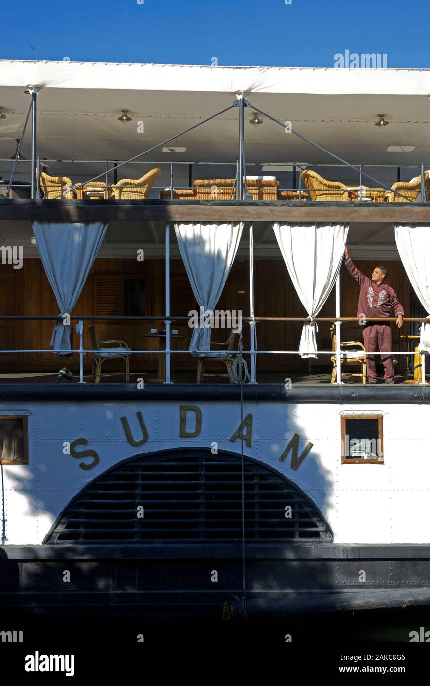 Egypt, Upper Egypt, Nile Valley, staff member of the Steam Ship Sudan, the last steamboat crossing the Nile, in a gangway of the ship Stock Photo