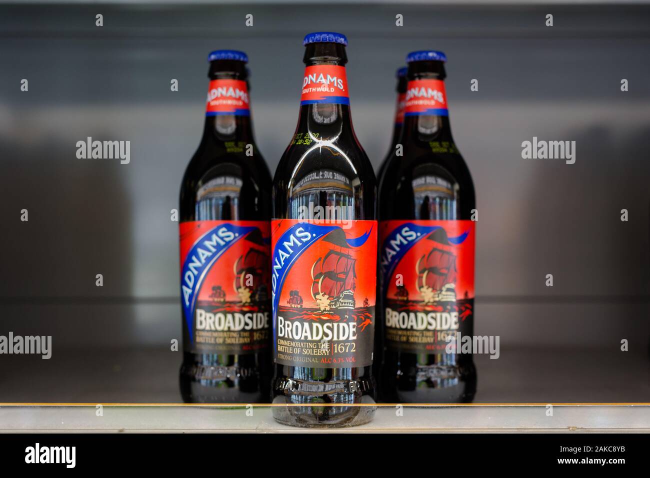 Woodbridge, Suffolk, UK November 01 2019; A trio of Adnams Broadside pale ale sitting on a shop shelf ready to be purchased Stock Photo