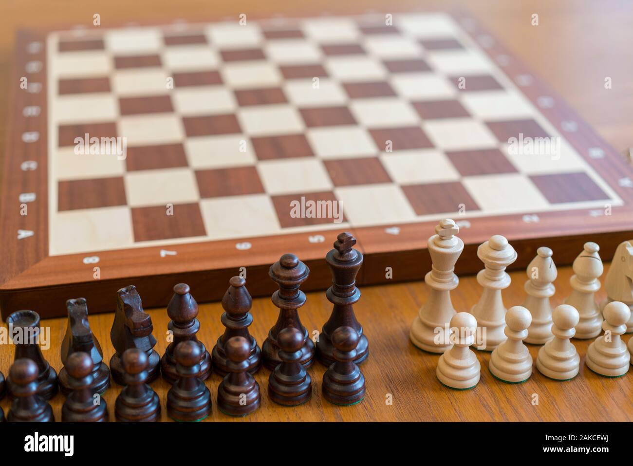 Chess pieces in front of a chessboard Stock Photo - Alamy