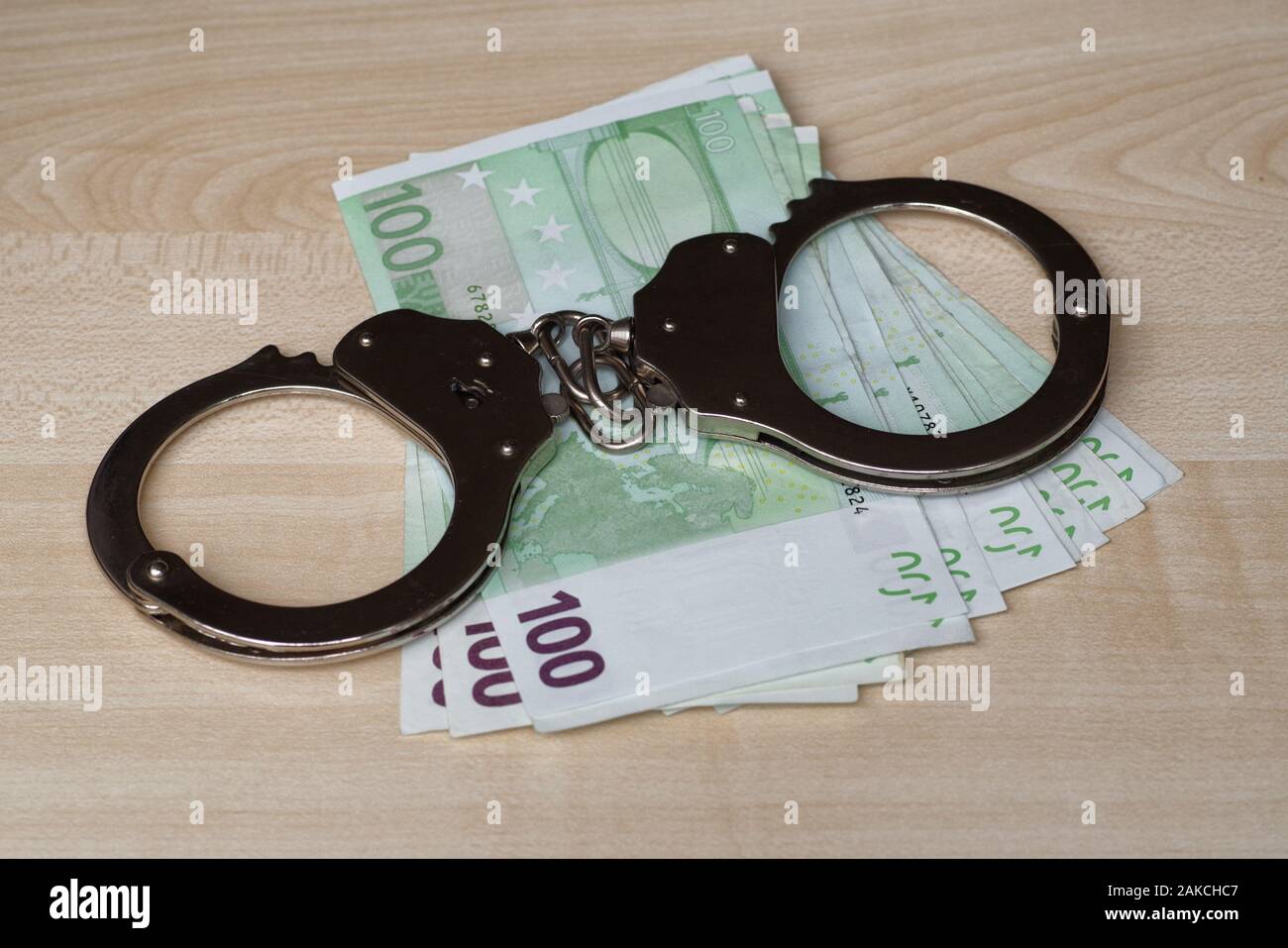 The concept of corruption. Money and handcuffs. Punishment for a bribe ...