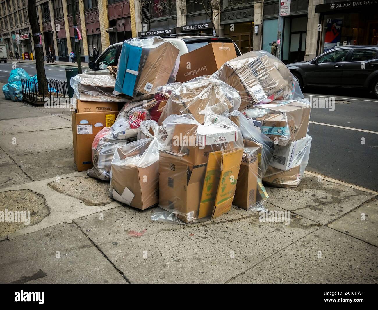 Cardboard boxes from Christmas shopping products waiting for trash pick-up outside of a building in New York on Friday, December 27, 2019. (© Richard B. Levine) Stock Photo