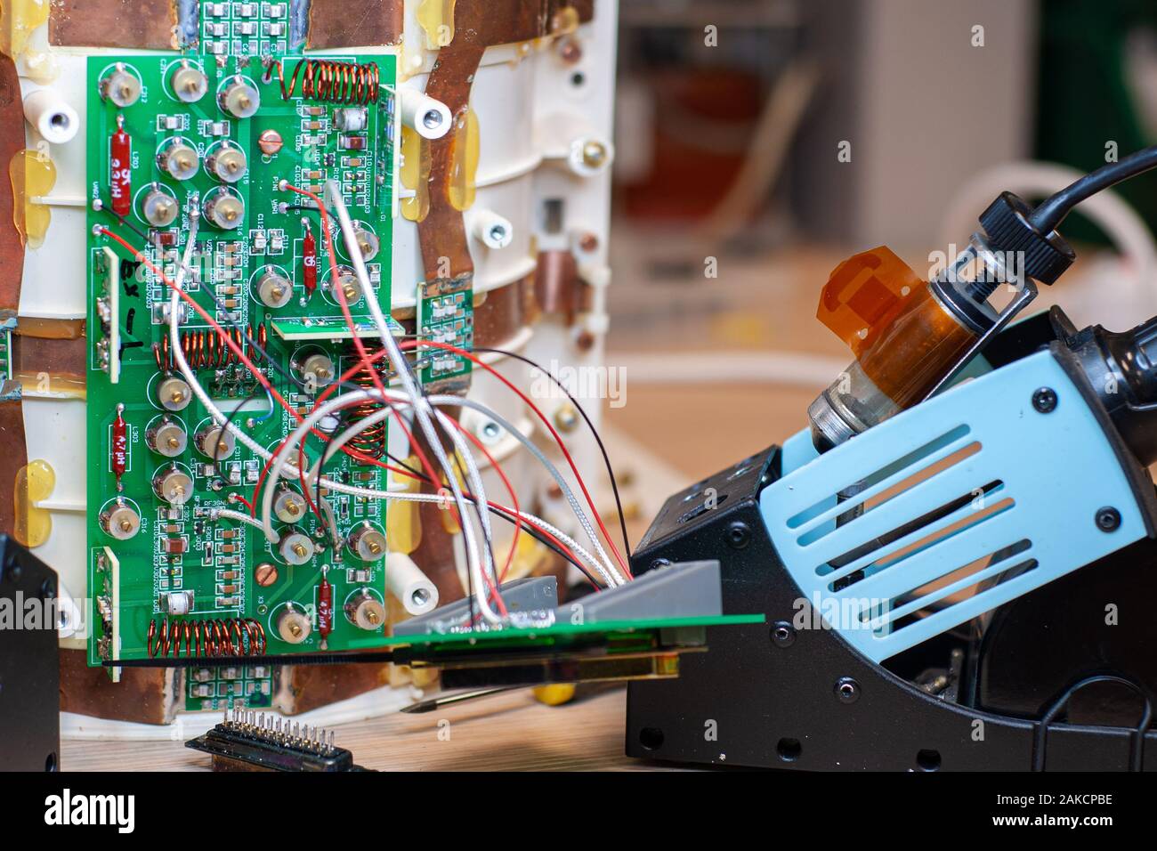 Electronic card during the replacement of components, for its repair in the laboratory Stock Photo