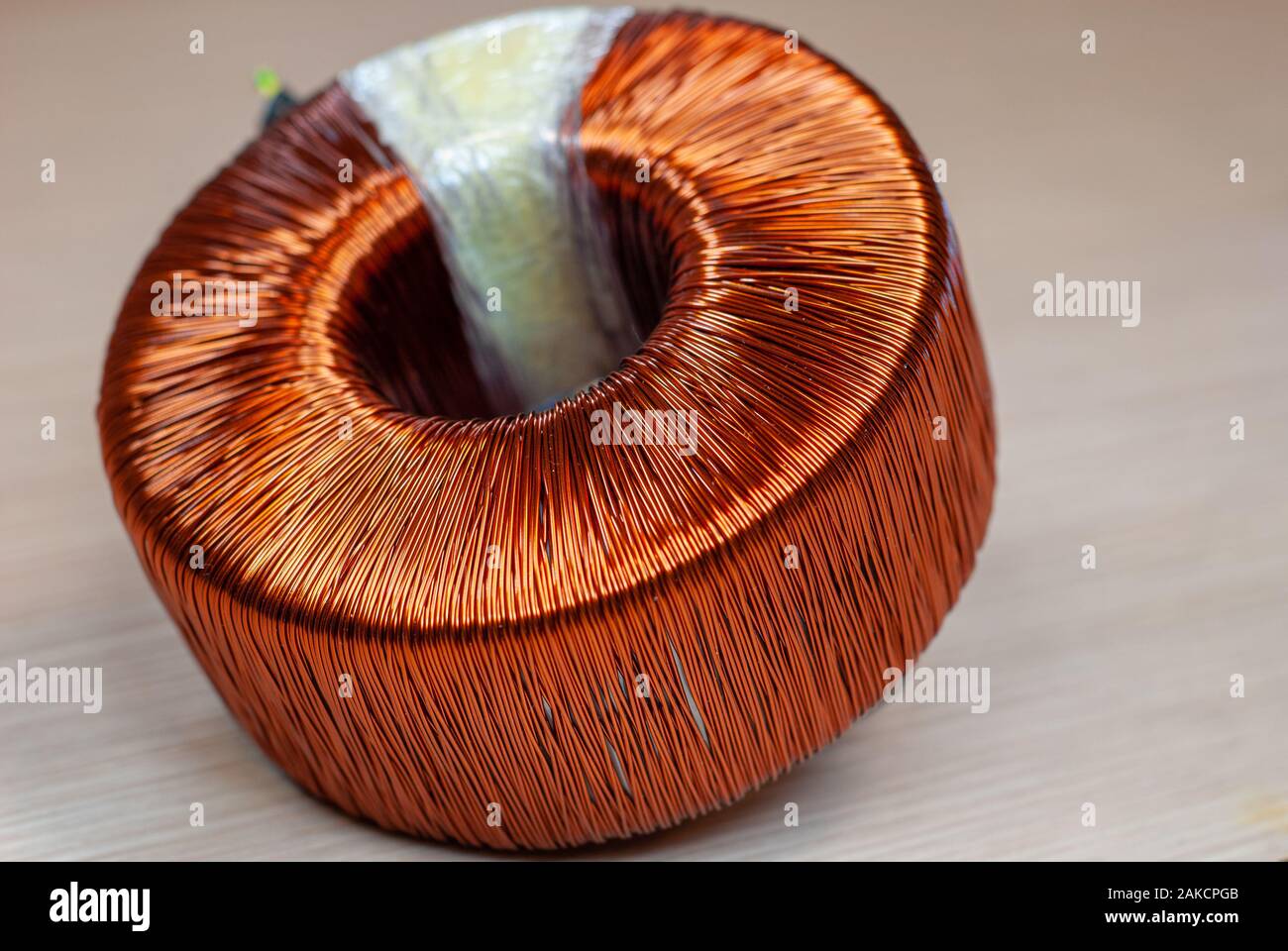 Insulated copper wires wrapped in coil, of a toroidal transformer Stock