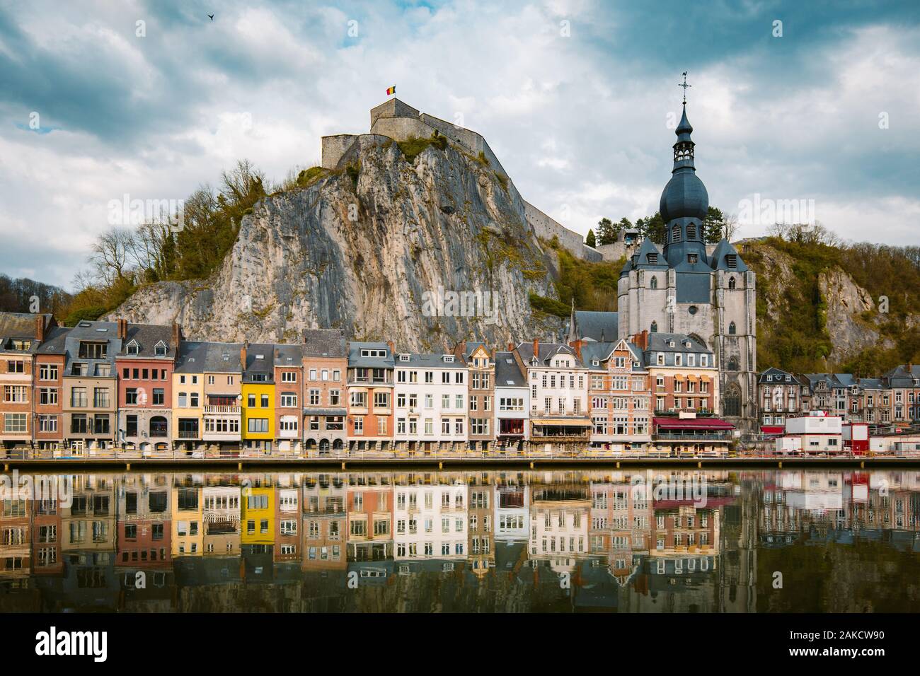 Classic view of the historic town of Dinant with scenic River Meuse in beautiful golden evening light at sunset, province of Namur, Wallonia, Belgium Stock Photo