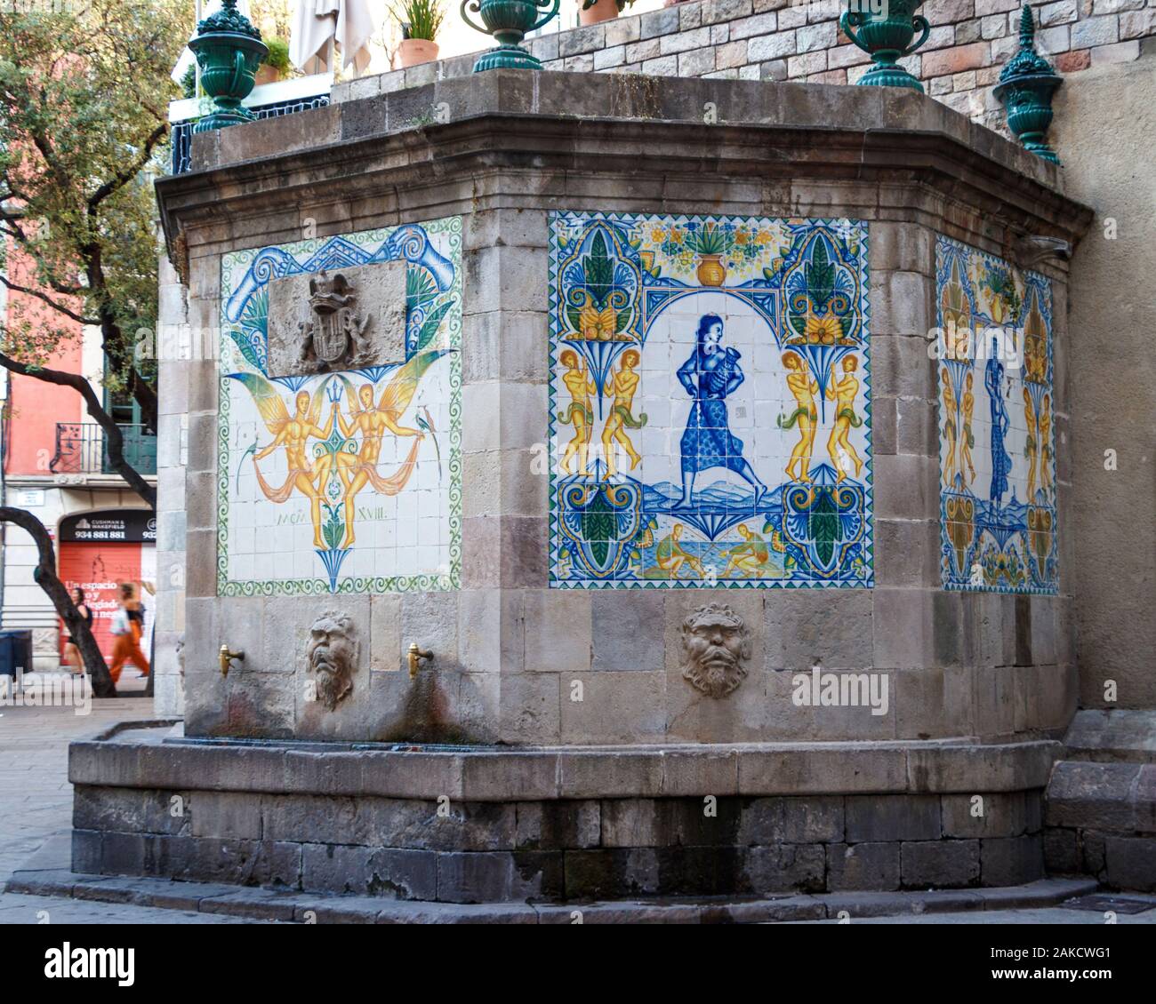 Decorative stone and tiled public drinking fountain. Barcelona, Spain