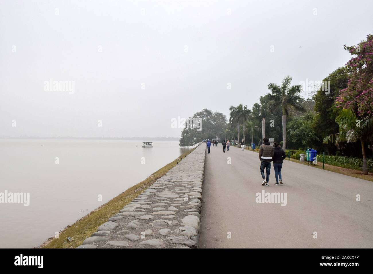 Chandigarh, India. 8th Jan, 2020. Visitors walk along the promenade of