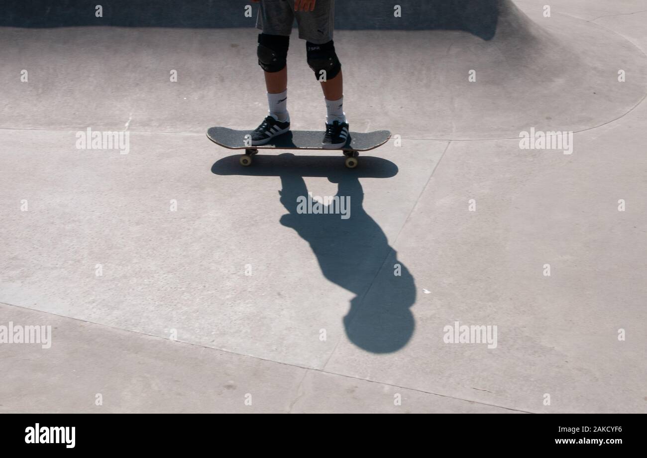 boy's shadow on a skateboard Stock Photo