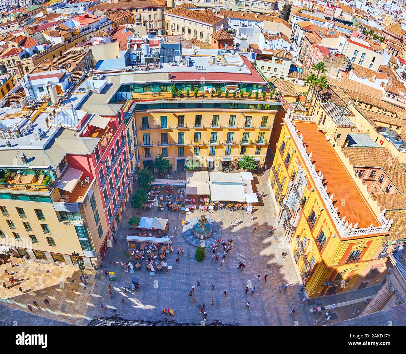 MALAGA, SPAIN - SEPTEMBER 26, 2019: Bird's eye view on Plaza Obispo with fountain, outdoor cafes, Baroque Bishop's Palace (Palacio Episcopal) from roo Stock Photo