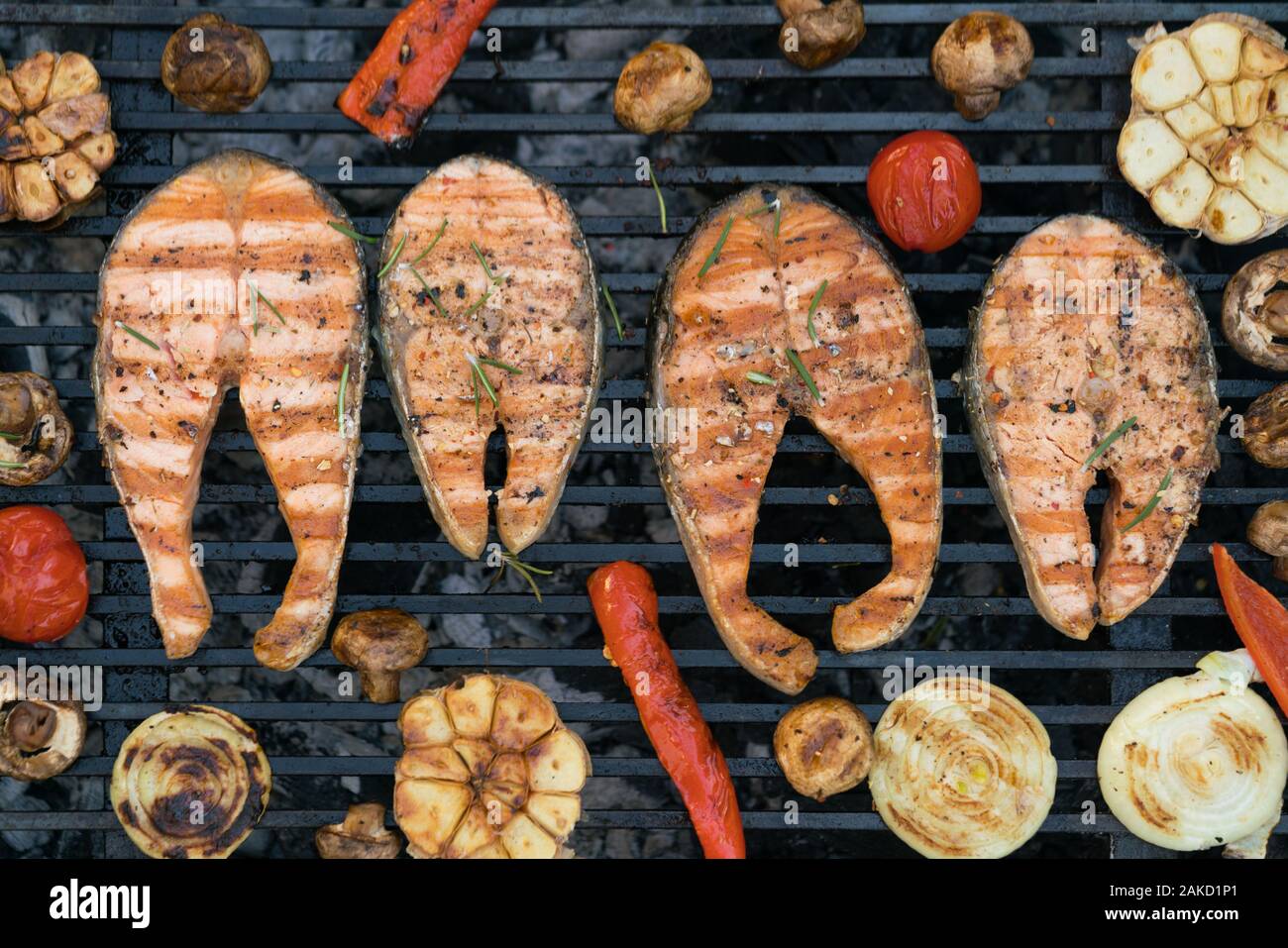 grilled salmon steaks with vegetables on the grill Stock Photo - Alamy
