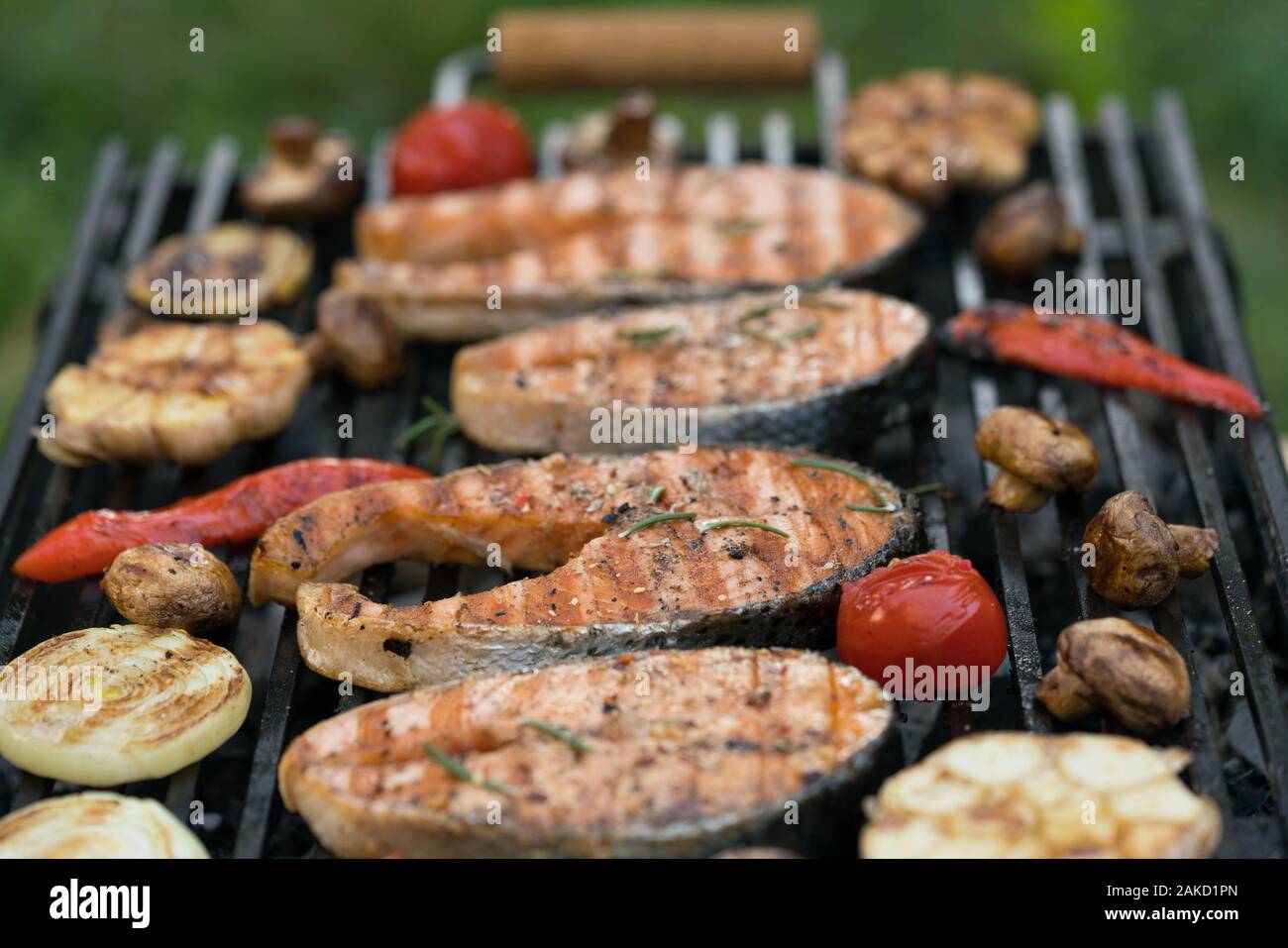 grilled salmon steaks with vegetables on the grill Stock Photo - Alamy