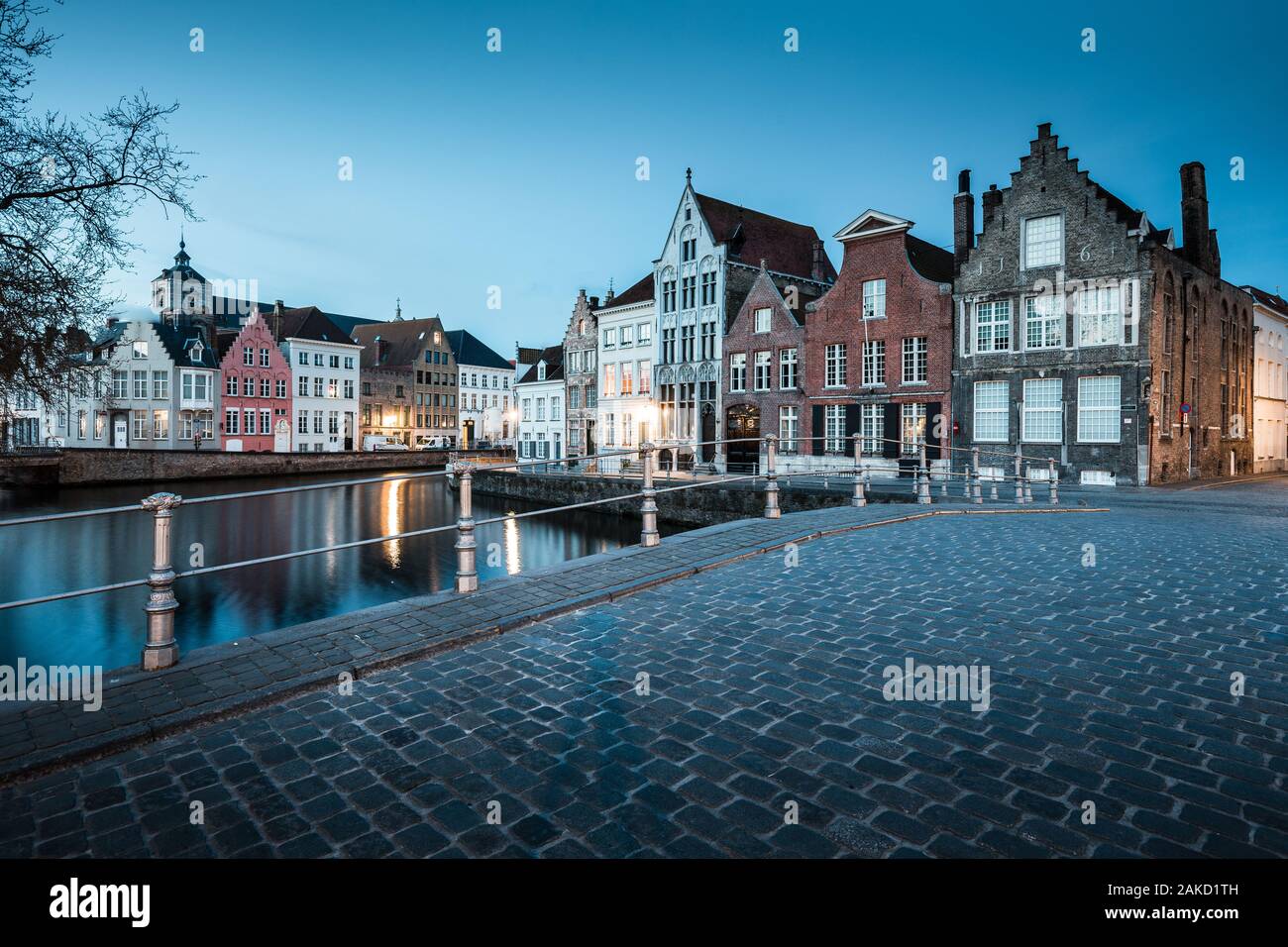 Classic panoramic twilight view of the historic city center of Brugge during beautiful evening blue hour at dusk, province of West Flanders, Belgium Stock Photo
