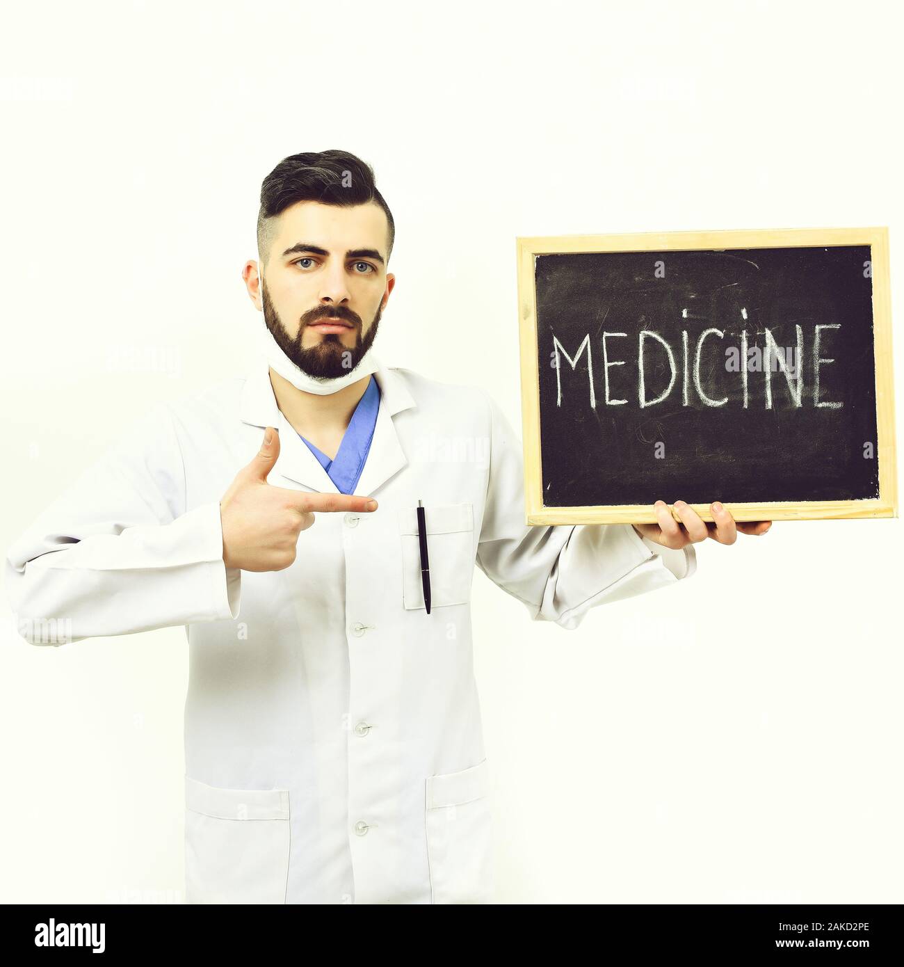 Man With Serious Face In White Medical Gown Isolated On White