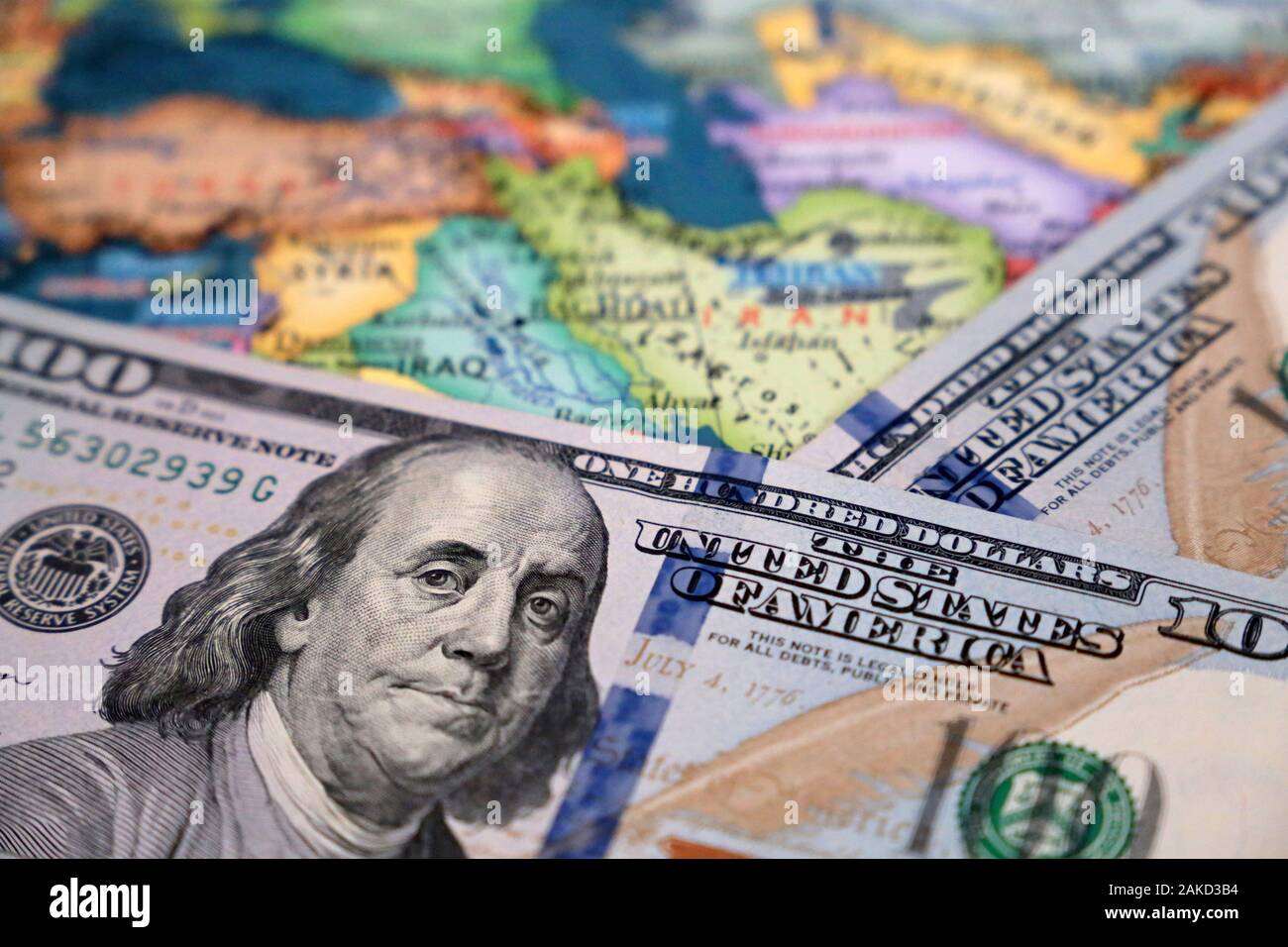 US dollars on the map of Iran and Iraq. Conflict between Washington and Tehran, trading in middle East, oil industry Stock Photo