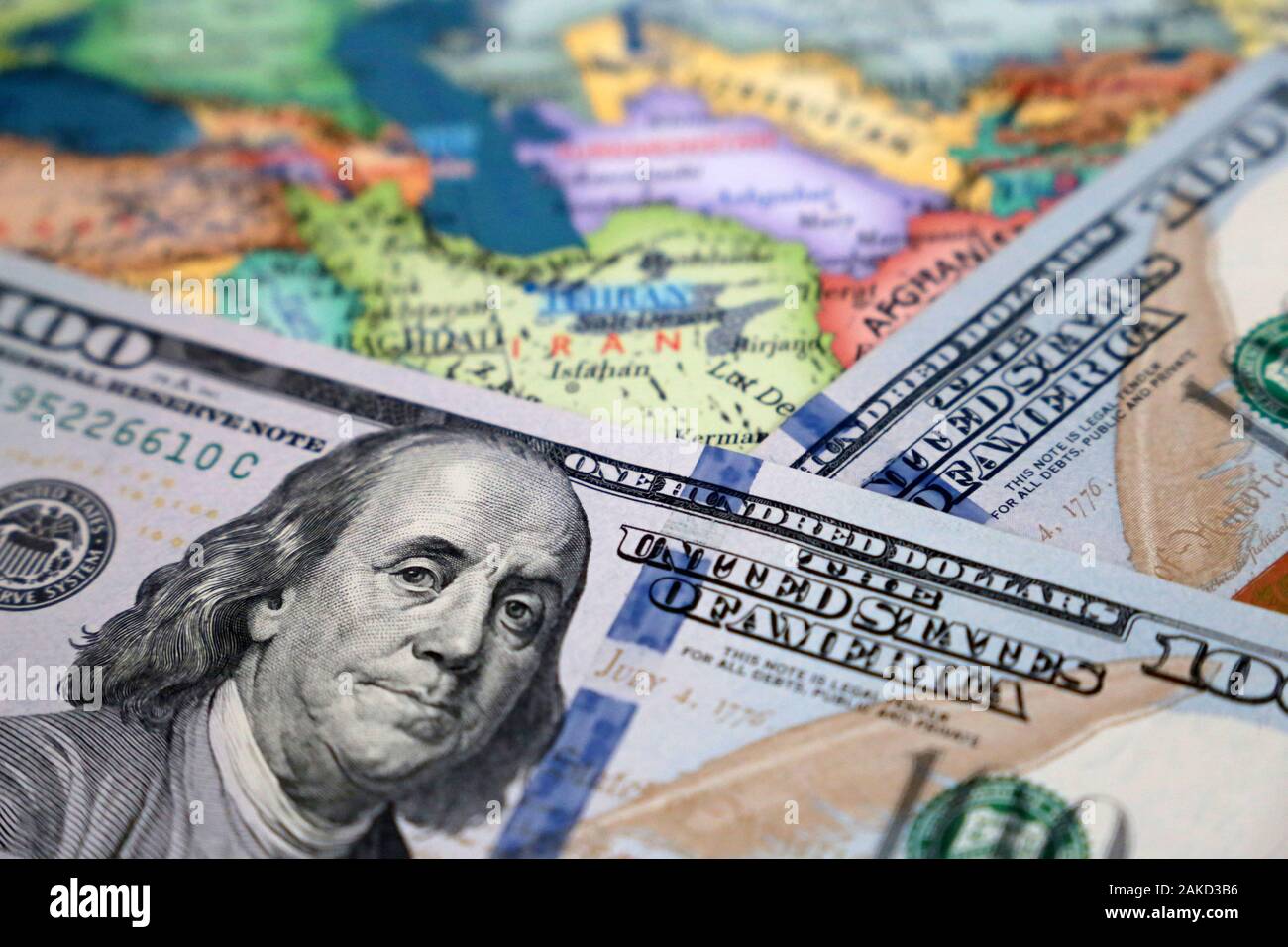 US dollars on the map of Iran and Iraq. Conflict between Washington and Tehran, trading in middle East, oil industry Stock Photo