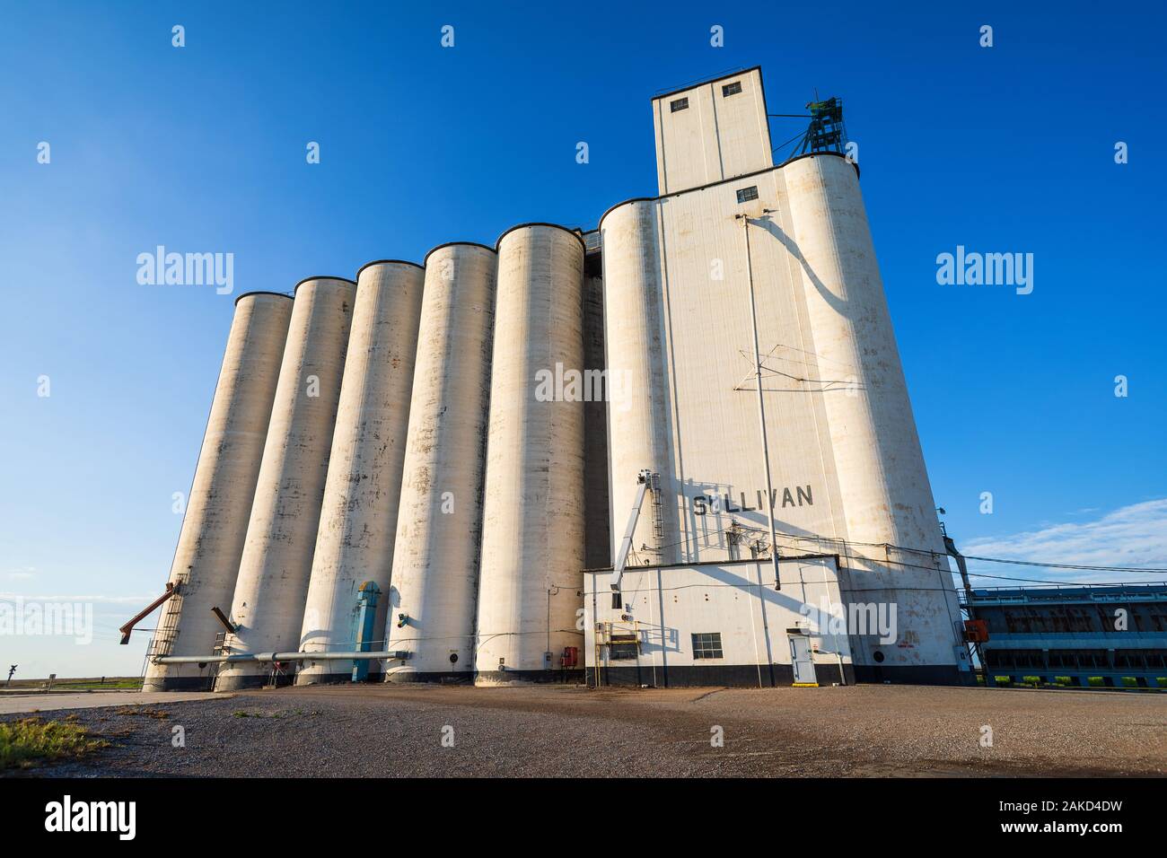 Late afternoon sunlight illuminates the Sullivan Grain Elevator in Hickok, Kansas, USA Stock