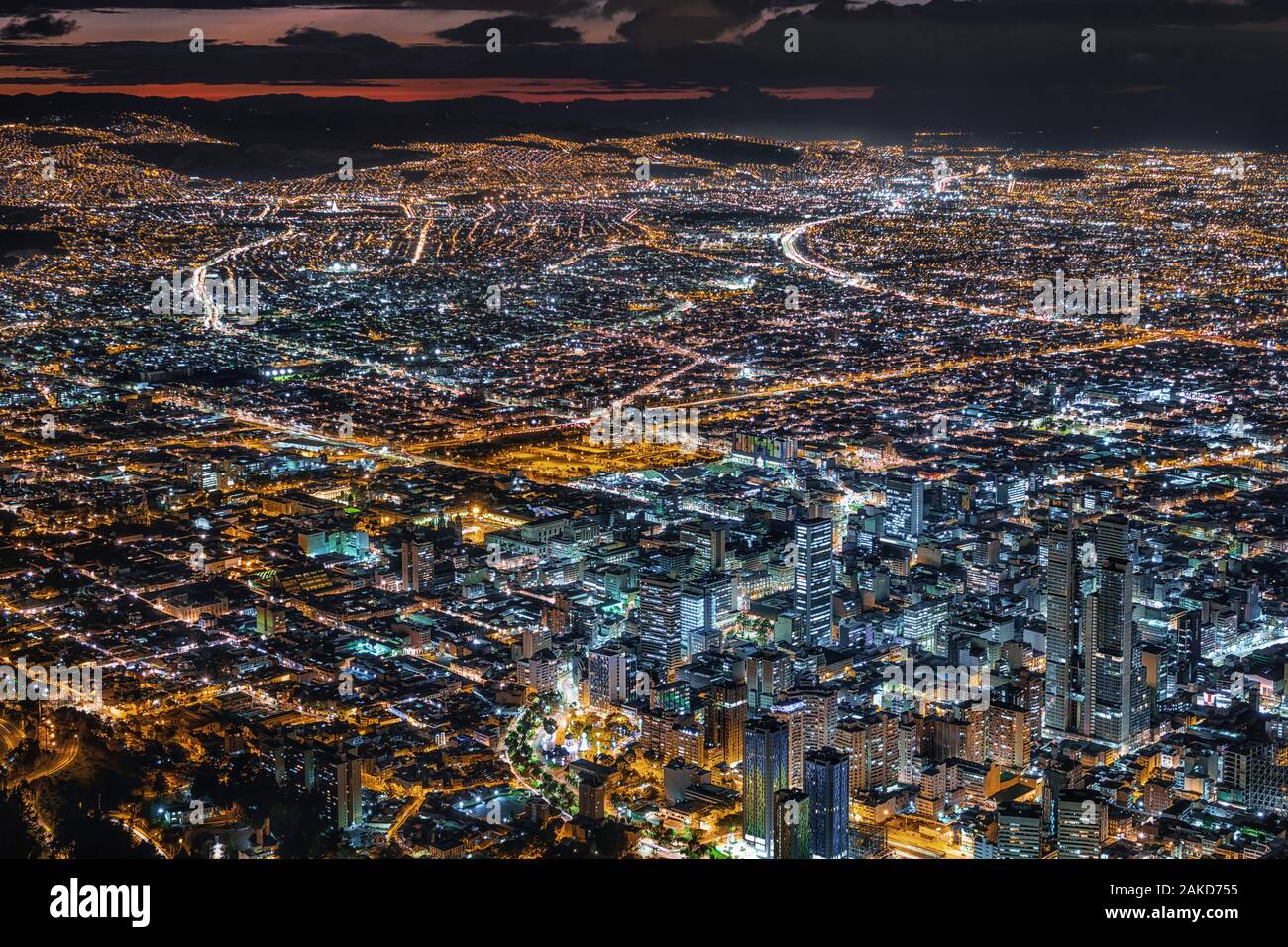 Bogota, Colombia, view of cityscape with downtown buildings illuminated at dusk. Stock Photo