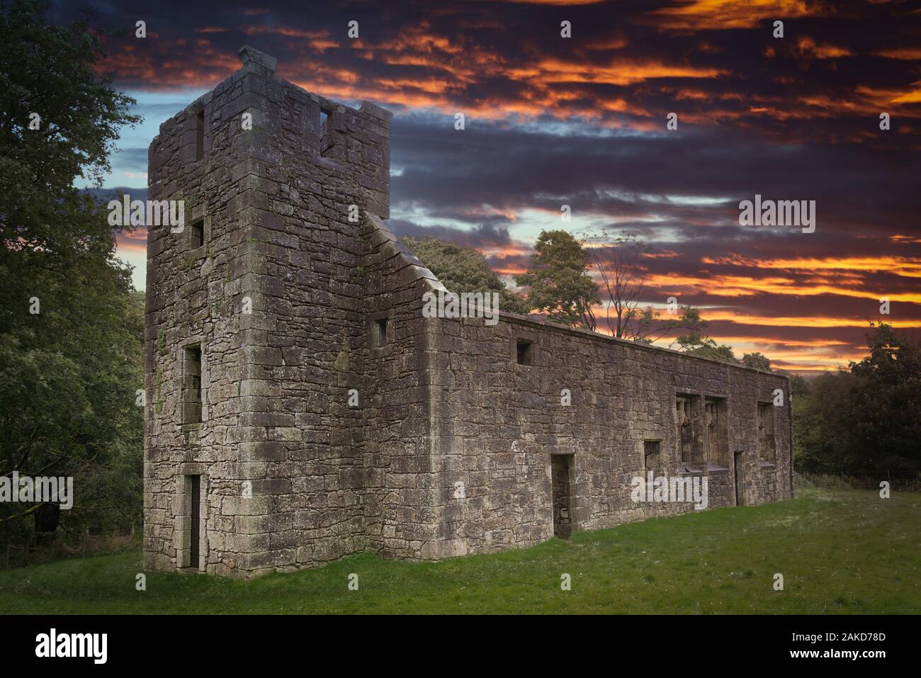 The ancient collegiate church at Castle Semple in Lochwinnoch at sunset with a Dramatic Firey Sky at the end of Summer. Stock Photo