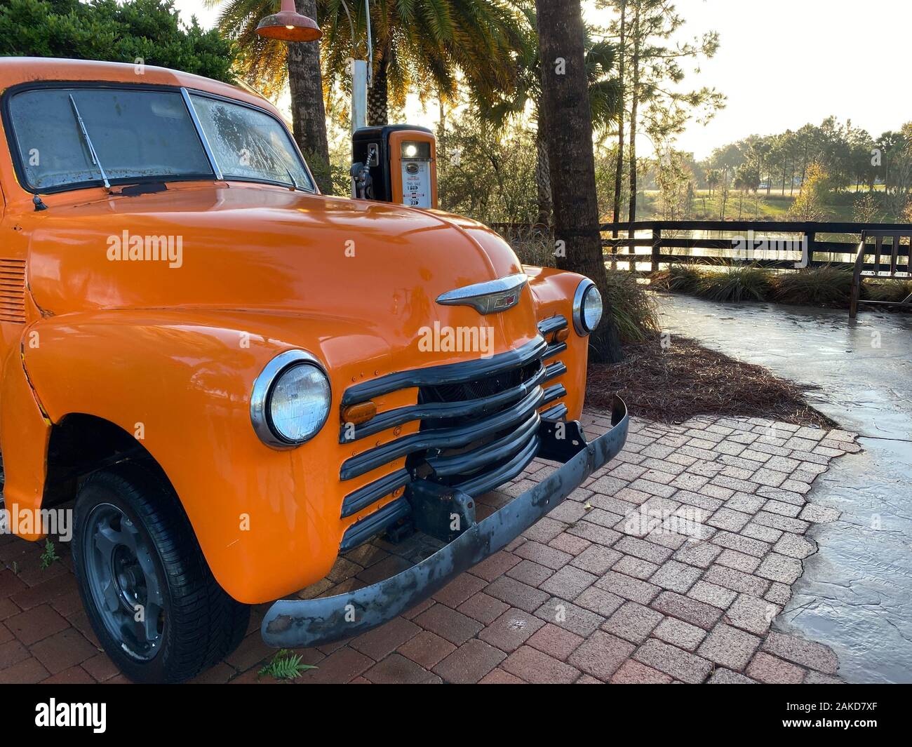 vintage old antique truck at gas station with cobblestone path side view Stock Photo