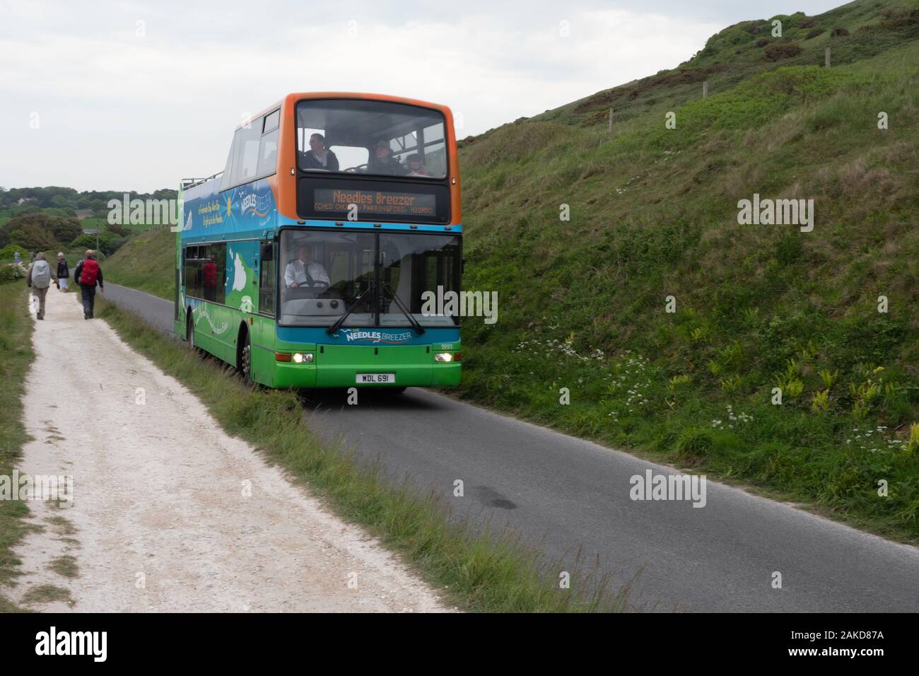 Needles Breezer WDL 691, a Plaxton President open top Volvo bus negotiating the hill to the Needles on the Isle of Wight Stock Photo
