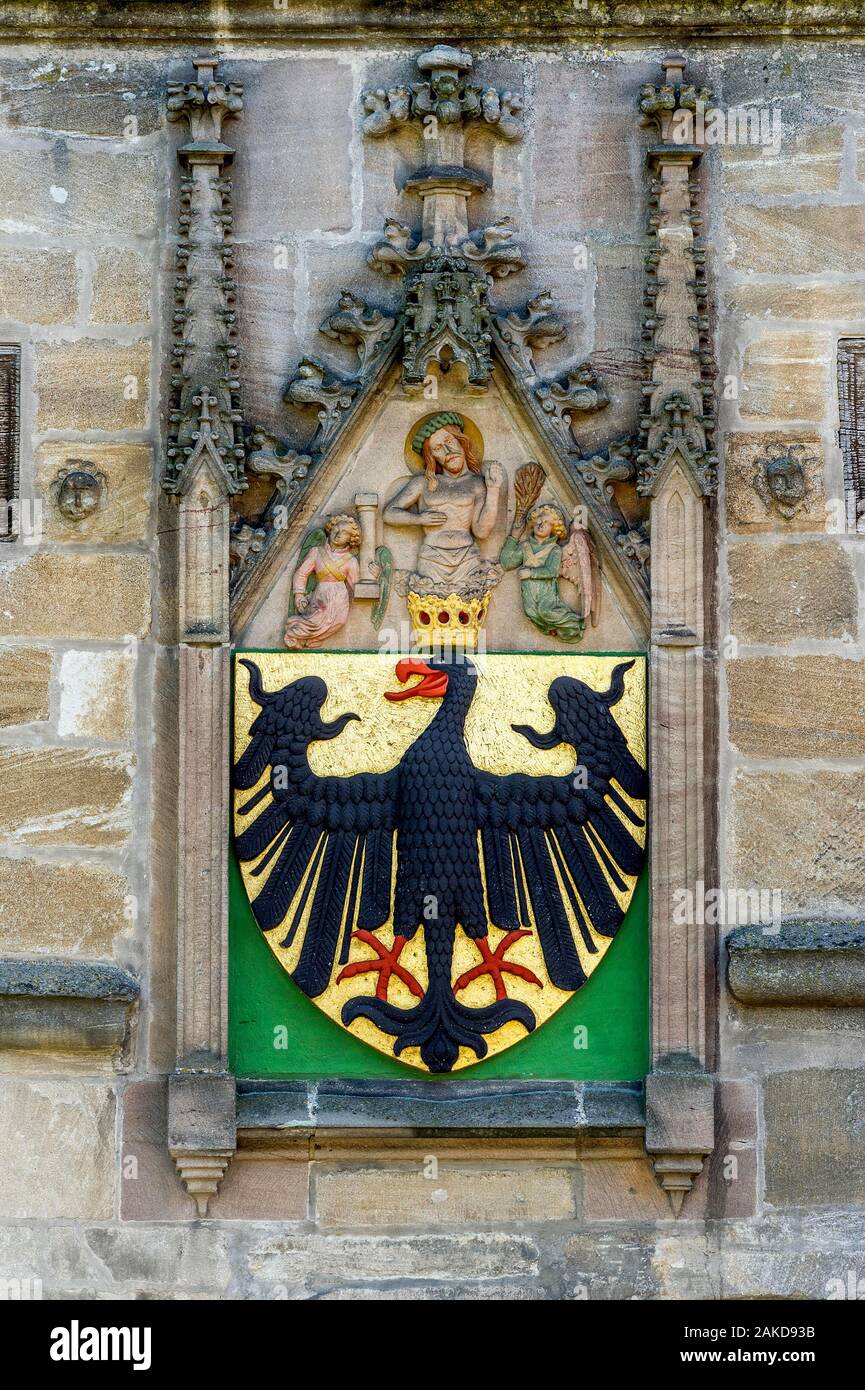 Imperial eagle, imperial coat of arms with devotional picture of Jesus Christ with angels at the Ellinger Tor, medieval city gate, old town Stock Photo