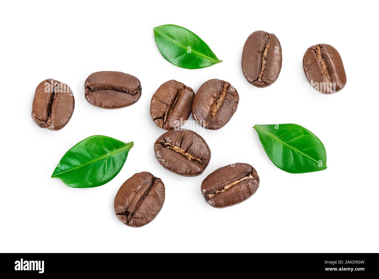Heap of roasted coffee beans with leaves isolated on white background ...