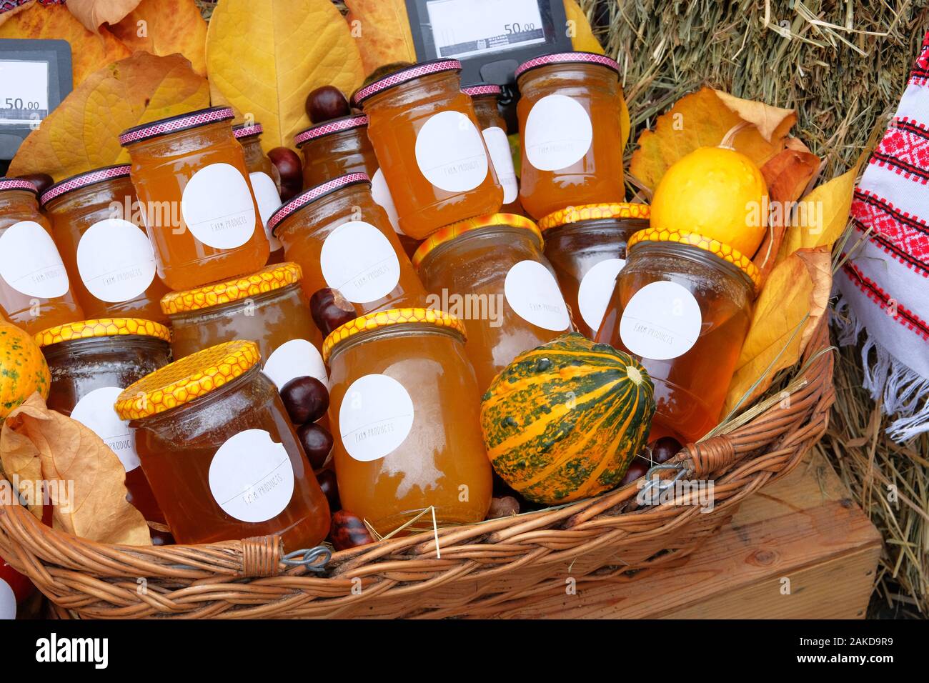 Jars with different types of honey in farmer agricultural market. Farm product in local market. Healthy food concept. Rustic style. Stock Photo