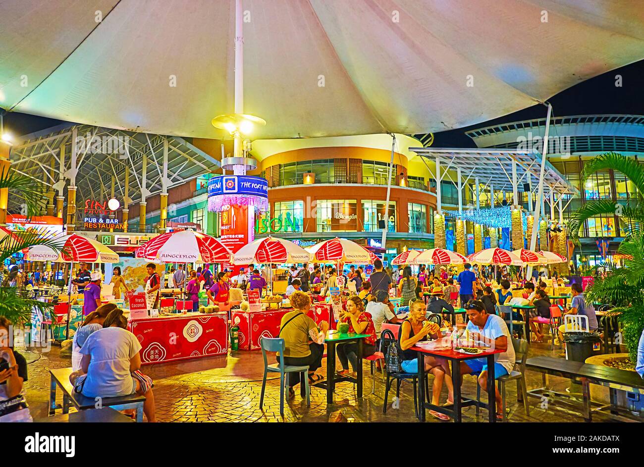 PATONG, THAILAND - MAY 1, 2019: The crowded outdoor cafe in courtyard of modern Jungceylon Shopping Center, famous among the tourists of Phuket, on Ma Stock Photo