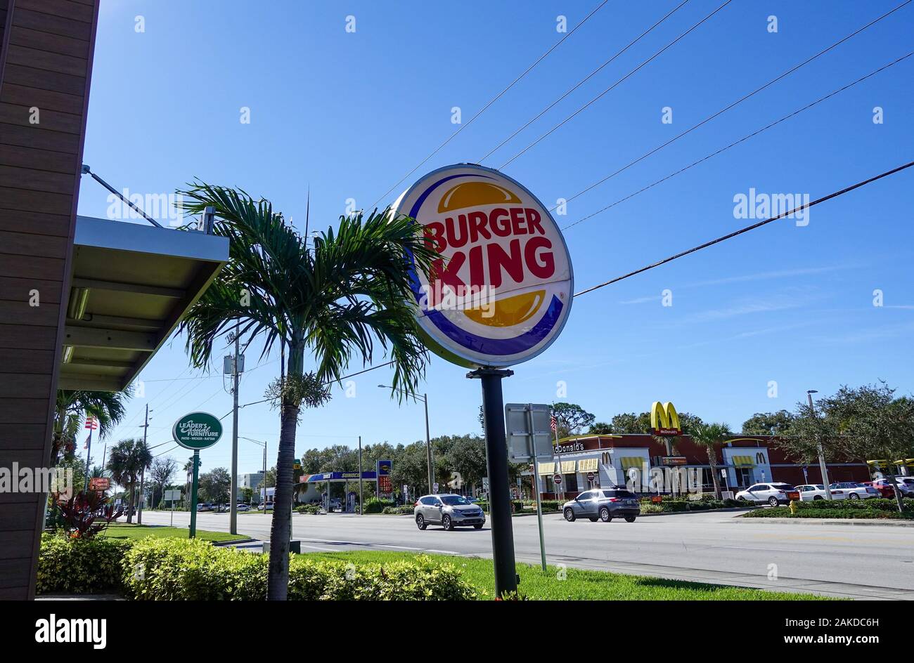 Vero Beach, FL/USA-1/6/90: A Burger King exterior sign with the competitor McDonalds across the street in the background on a bright sunny day. Stock Photo