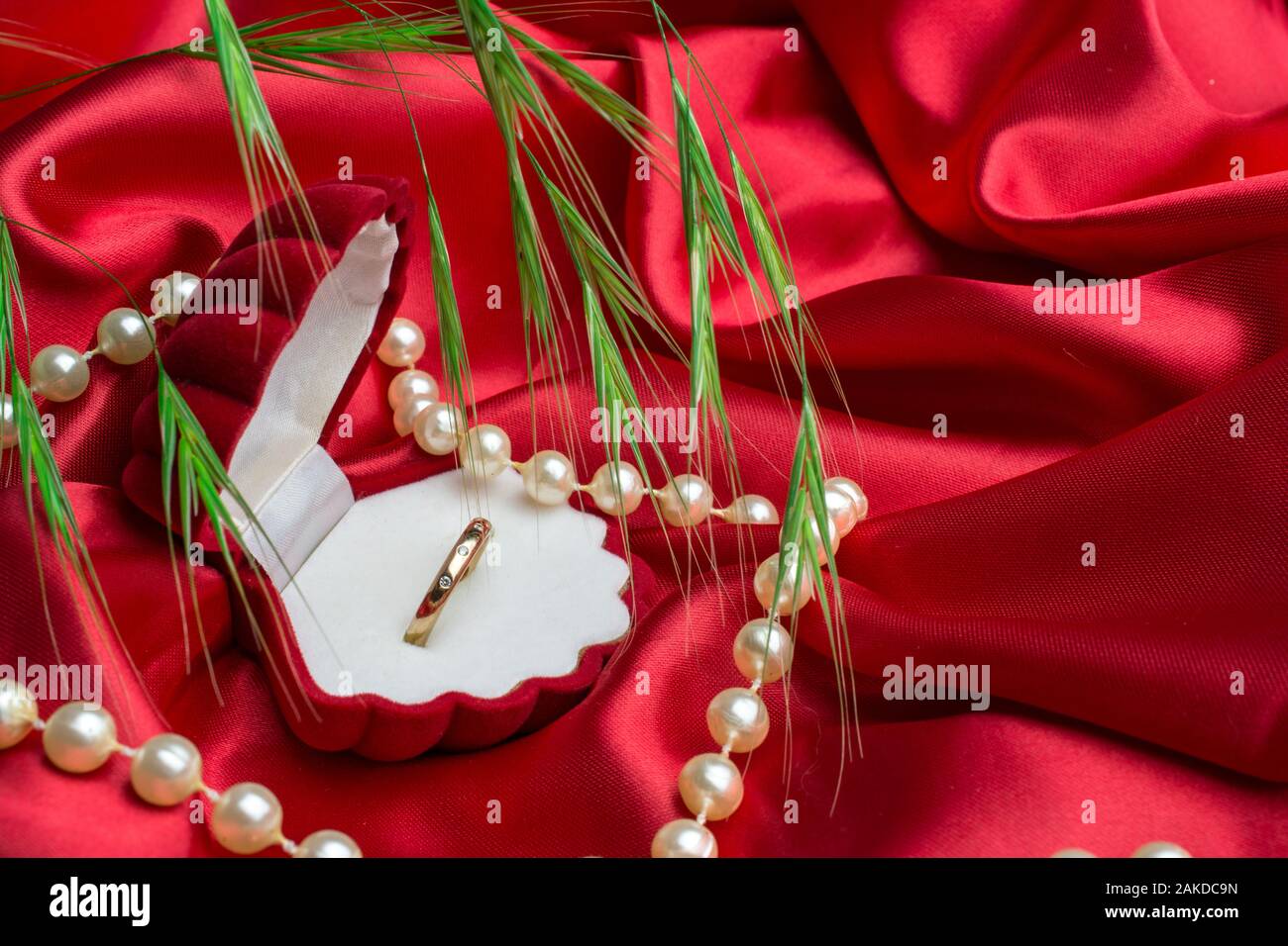 gold ring in box on red black backgroung Stock Photo