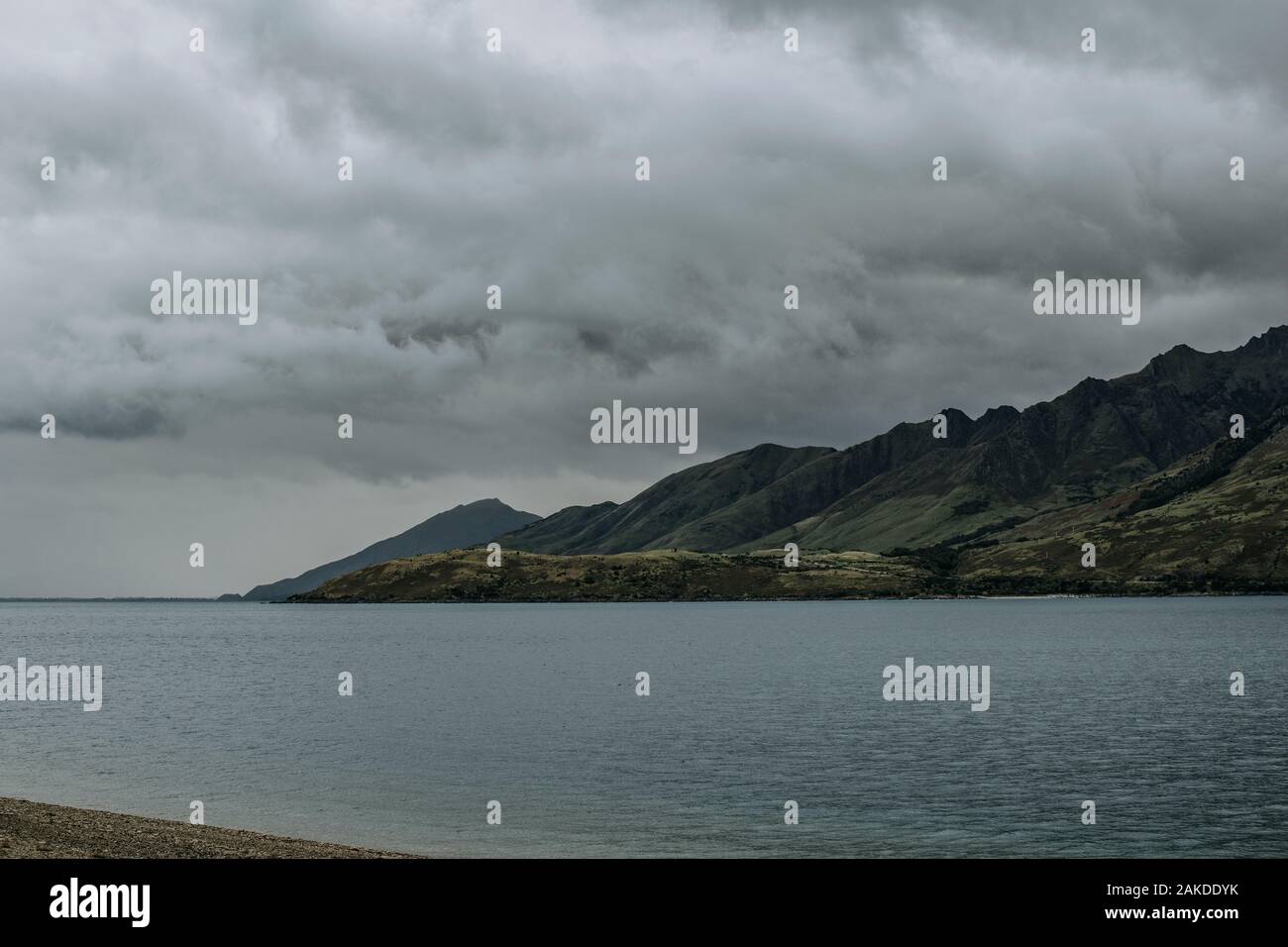 Storm clouds over the mountains surrounding Lake Hawea, New Zealand Stock Photo