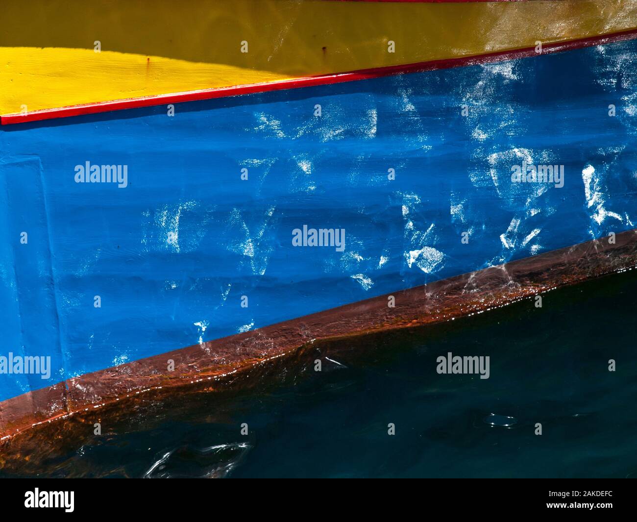 Abstract detail from a Malta fishing boat or Luzzu showing water casting  glimmer and reflections on paintwork Stock Photo - Alamy