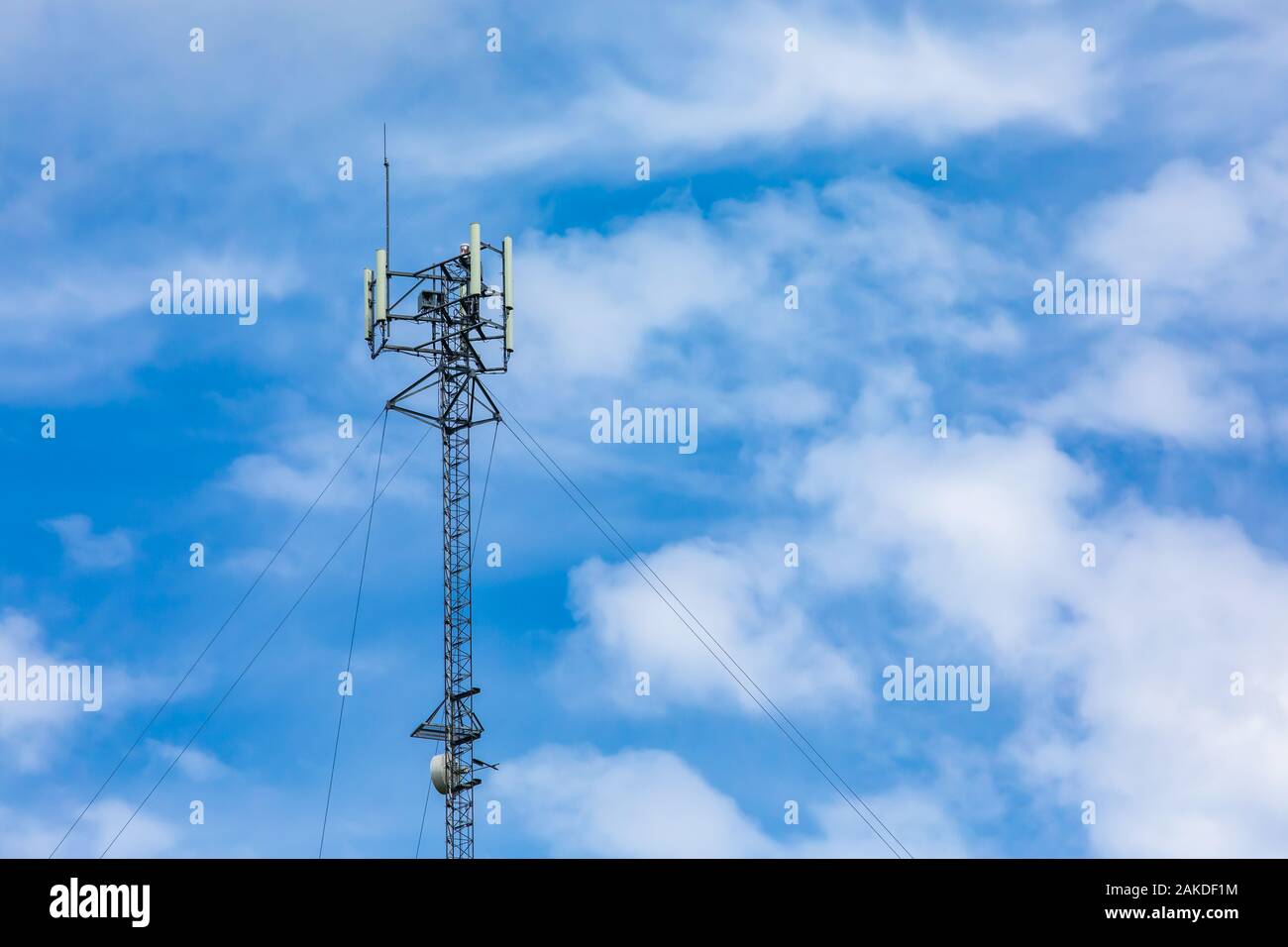 A low angle view of a cable stayed cellular base station, used in the