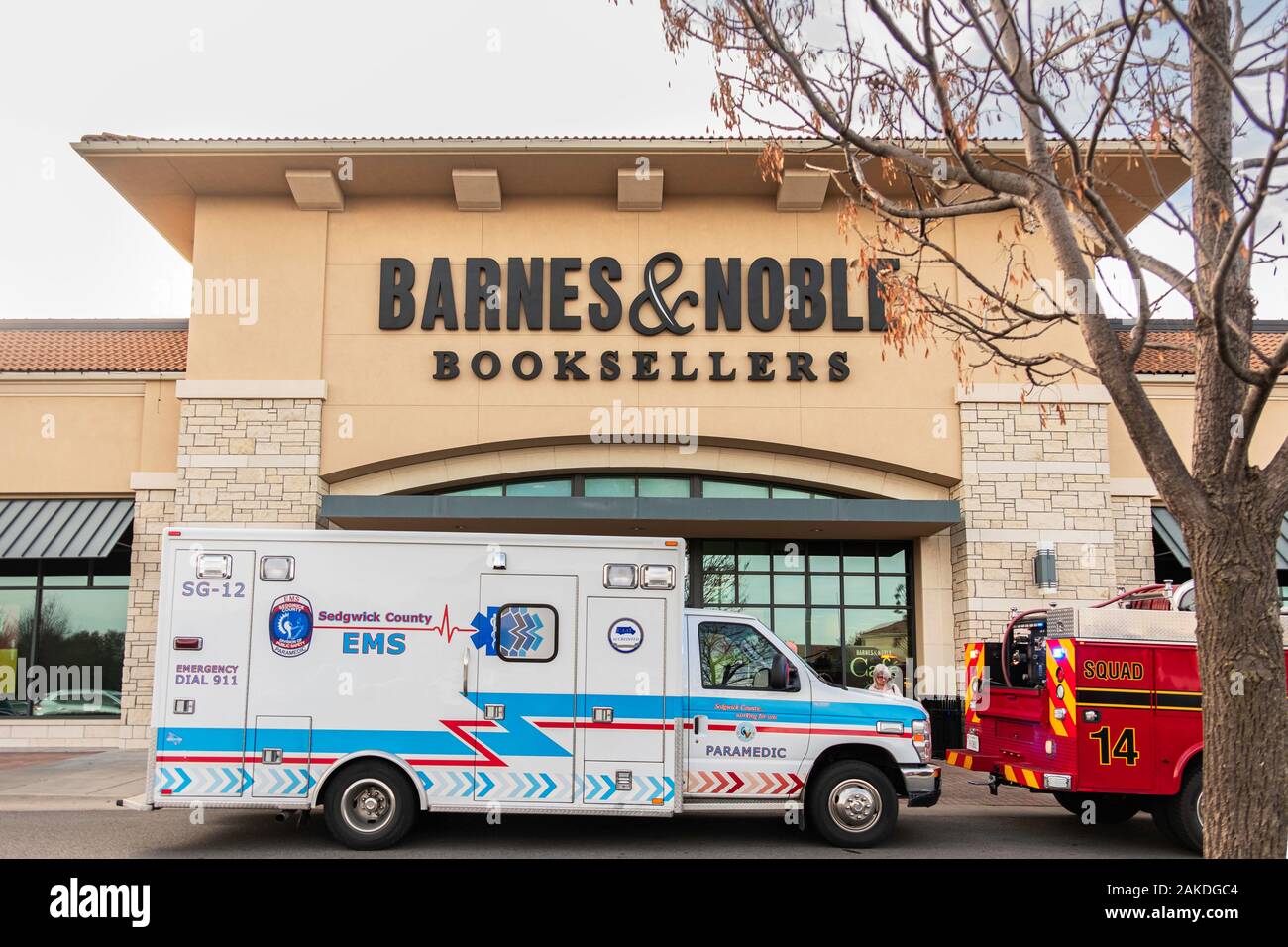 EMS ambulance on call while parked in front of Barnes & Noble booksellers storefront in Bradley Fair shopping center, Wichita, Kansas, USA. Stock Photo
