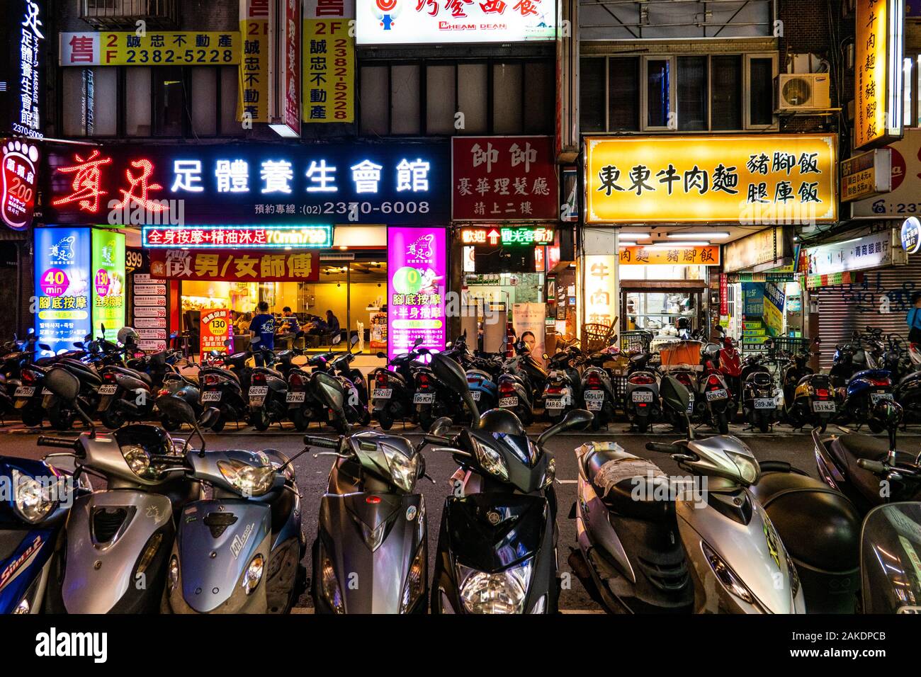 Countless motor scooters line the streets of Taipei Stock Photo