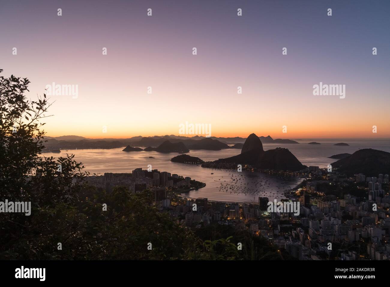 Sunrise from Mirante Dona Marta in Rio de Janeiro overlooking Sugarloaf Moutain and Guanabara Bay. Stock Photo